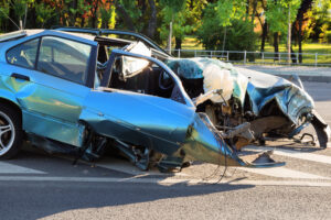blue car destroyed after horrible car accident